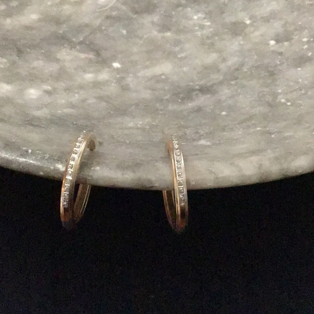 Yellow metal earrings with clear white stones